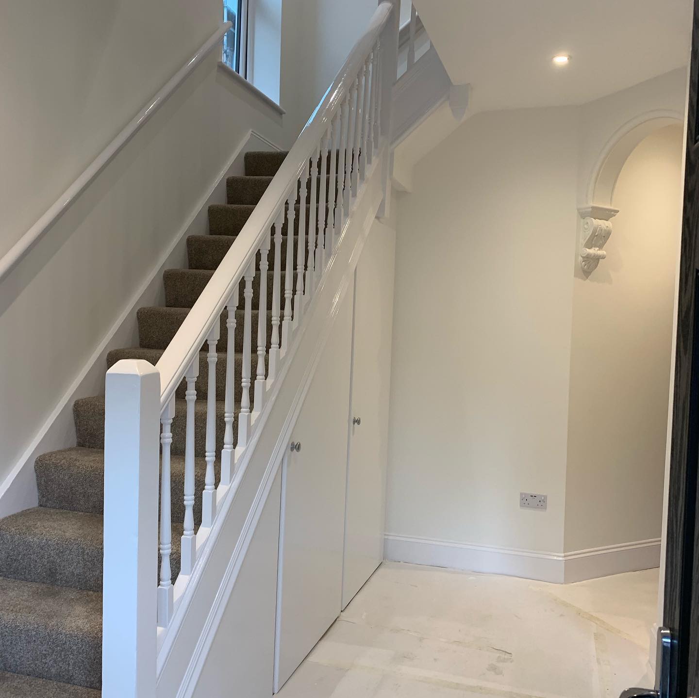 Painted stairs and hall by Pastilles Painters and Decorators in Hampshire